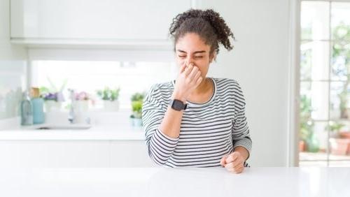 woman smelling smoke