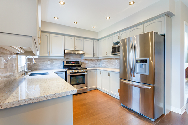 white kitchen with chrome appliances