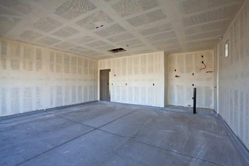 garage walls with unpainted drywall